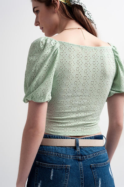 Green short top in batiste fabric with puffed sleeves