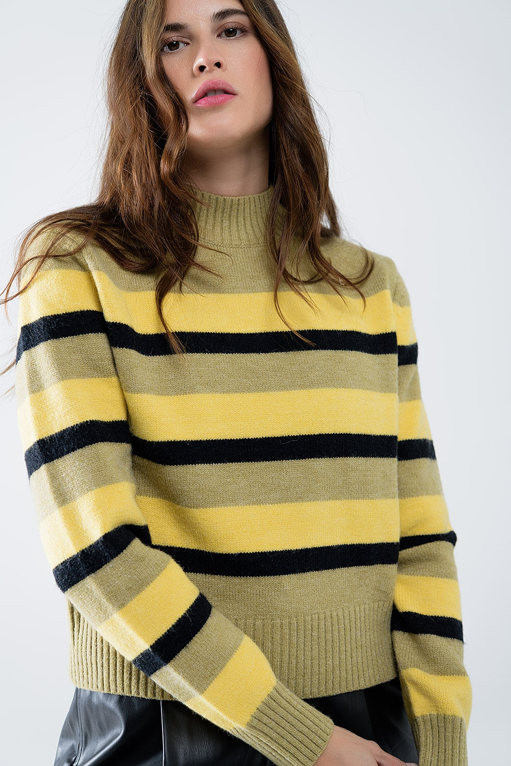 Green sweater with black and yellow stripes