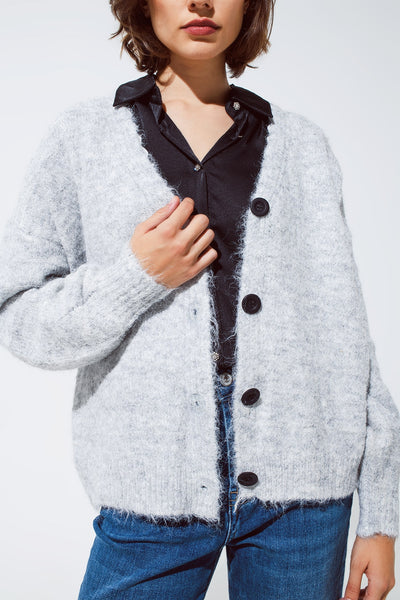 Grey cardigan with a deep V neck with lace detail