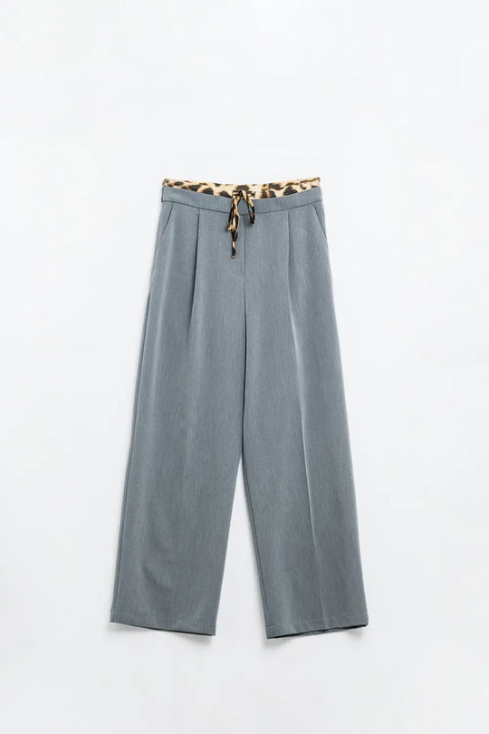 Q2 Grey pleated pants with leopard detail at the waist