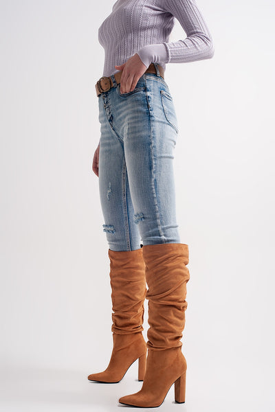 Heather skinny leg distressed jeans with button detail in light blue