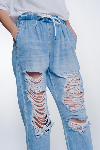 Heavily ripped boyfriend jeans in light denim