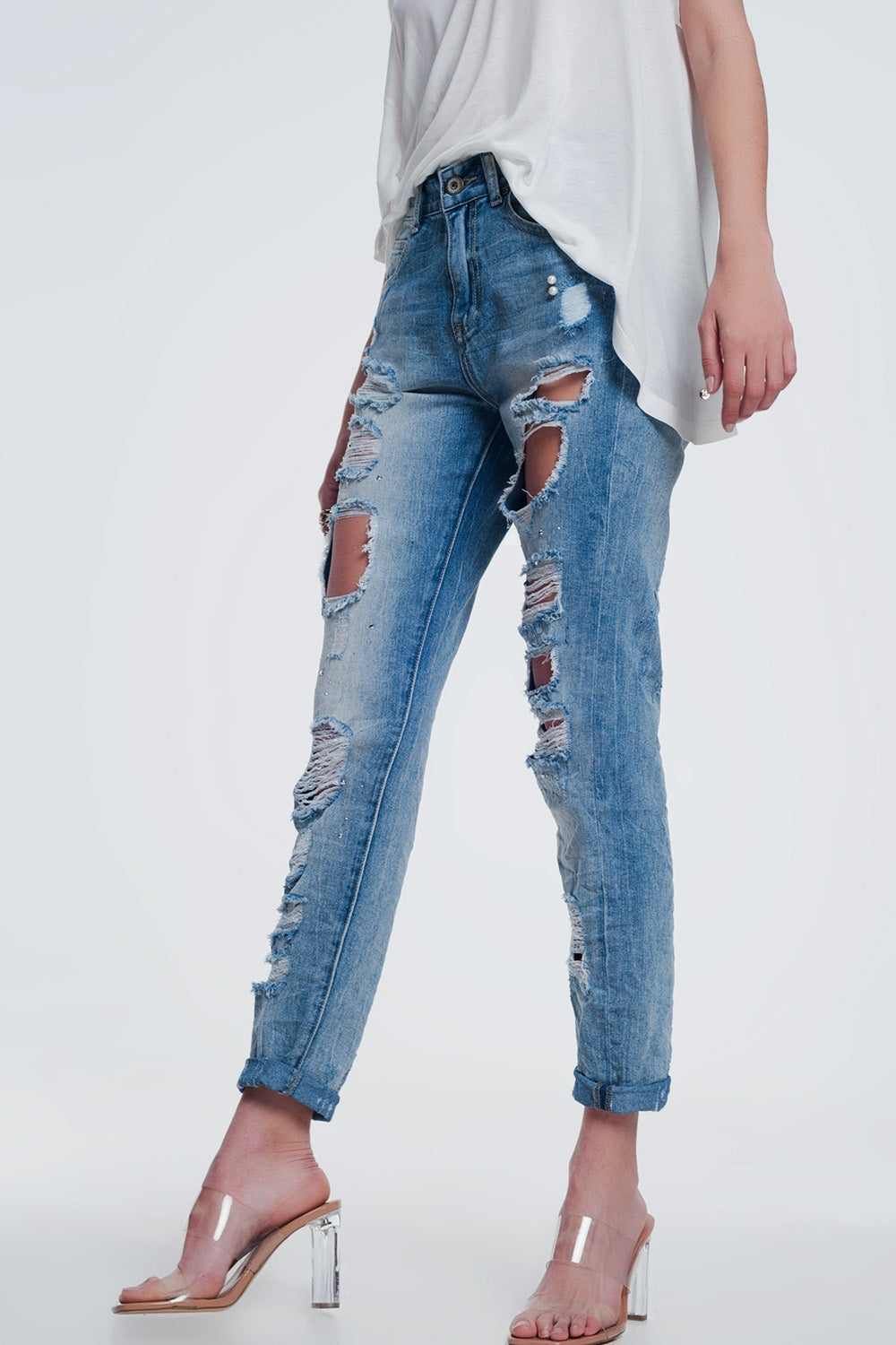 Heavily torn straight jeans in light denim