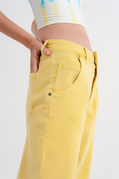 High rise mom jeans with pleat front in yellow