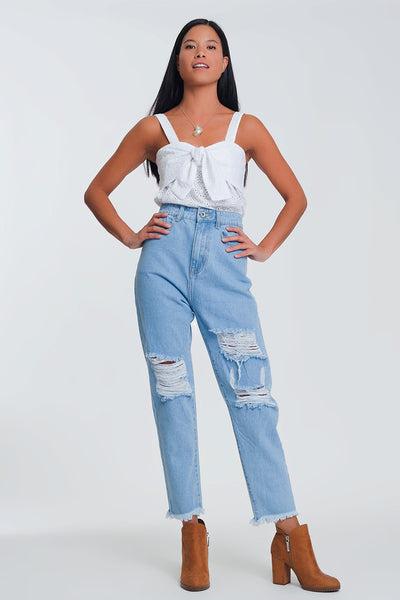 High waist mom jeans with busted knees in light denim