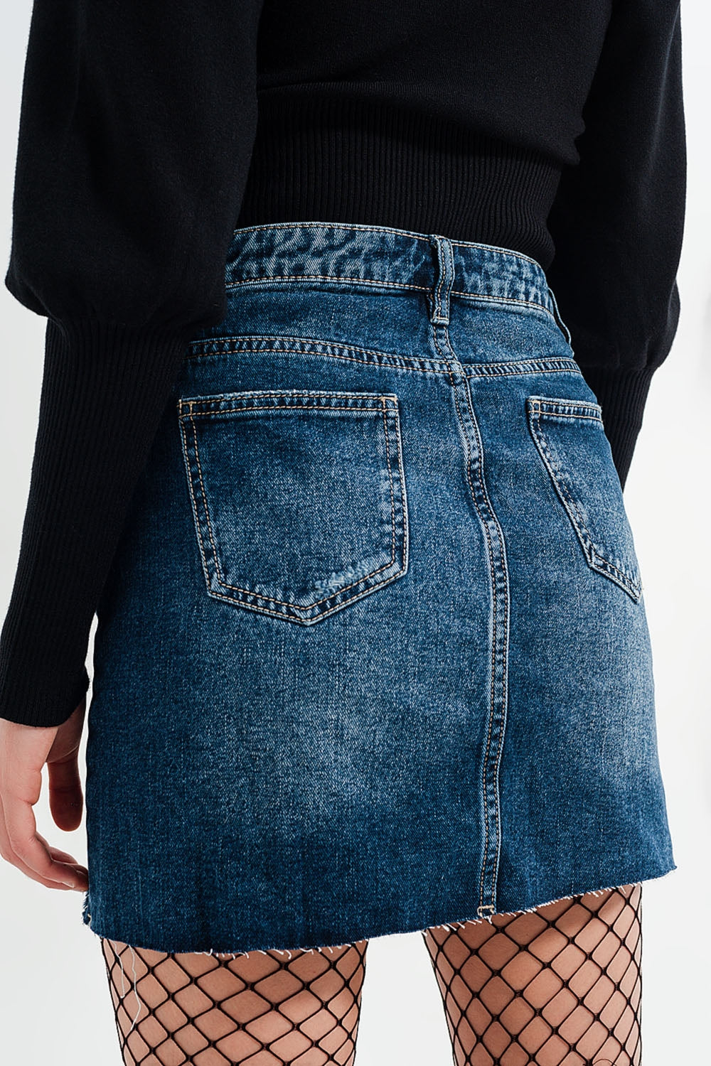 High waisted denim mini skirt with medium washed ripped