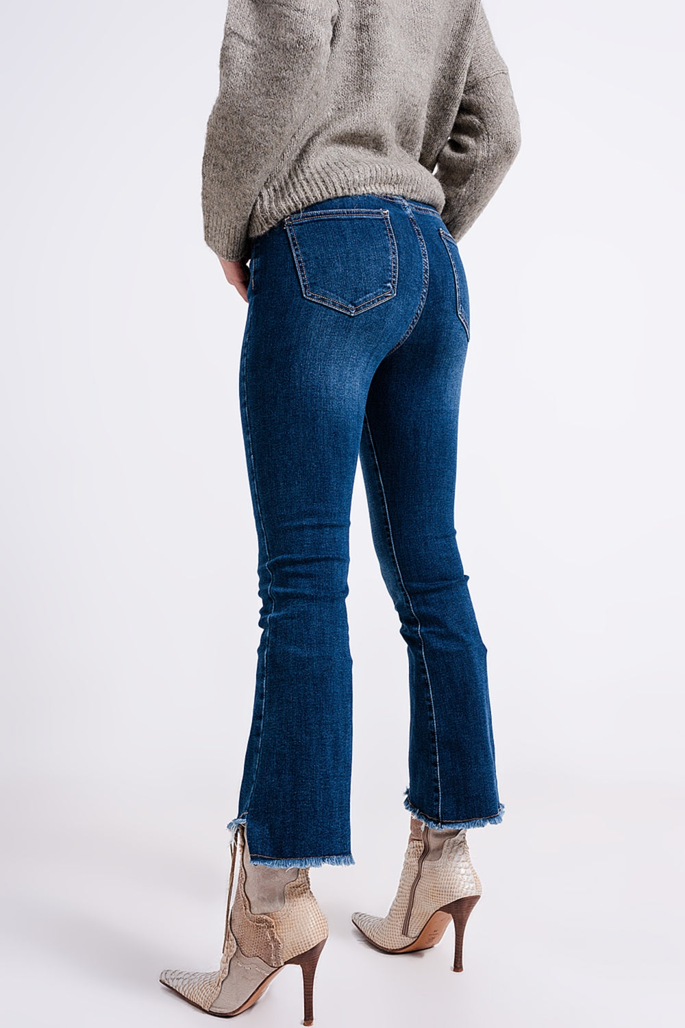 High waisted jeans with asymmetrical hem