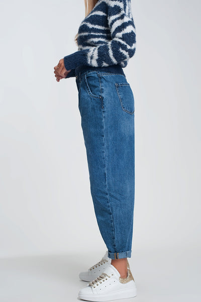 High waisted mom jeans with two ruffles in the waistline in dark wash blue