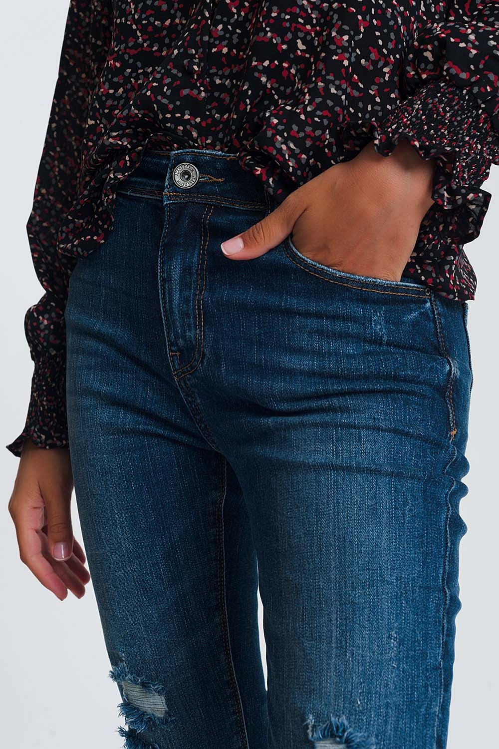 High waisted skinny jeans in dark wash blue with ripped details