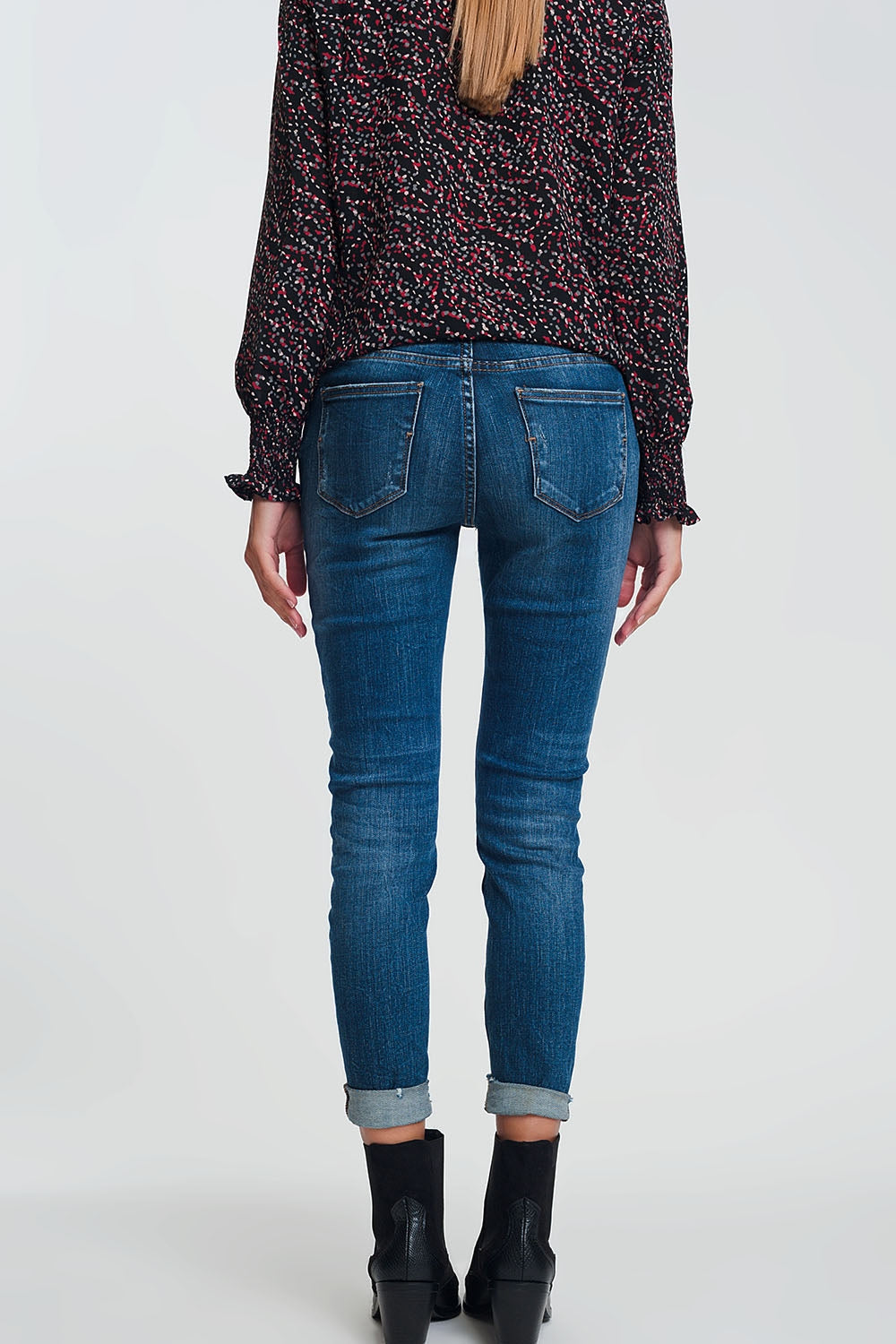 High waisted skinny jeans in dark wash blue with ripped details