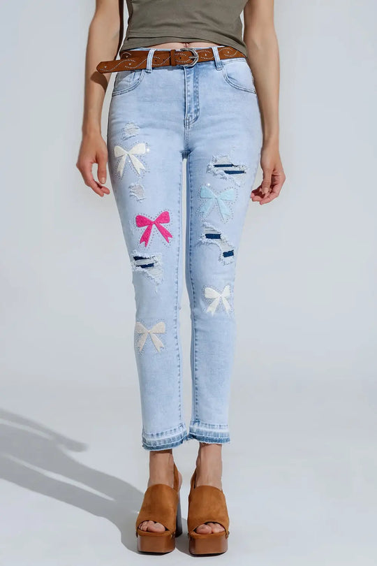 Q2 Jean super skinny bleu clair avec nœud papillon et trous déchirés