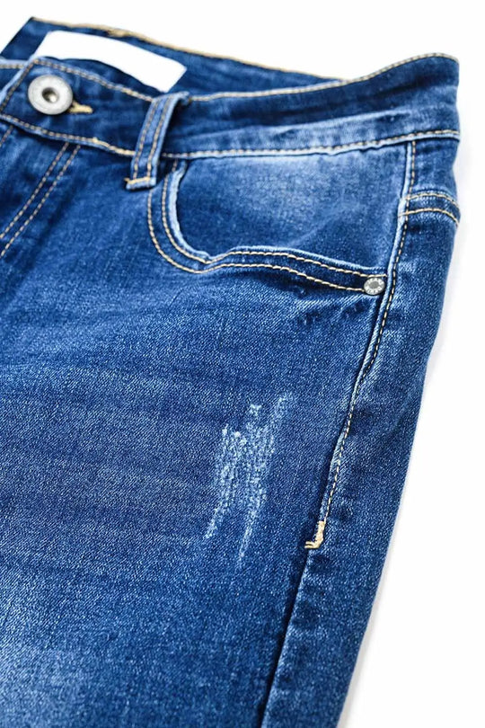 Jean super skinny en délavage moyen avec déchirures au bas de la jambe - Pantalons