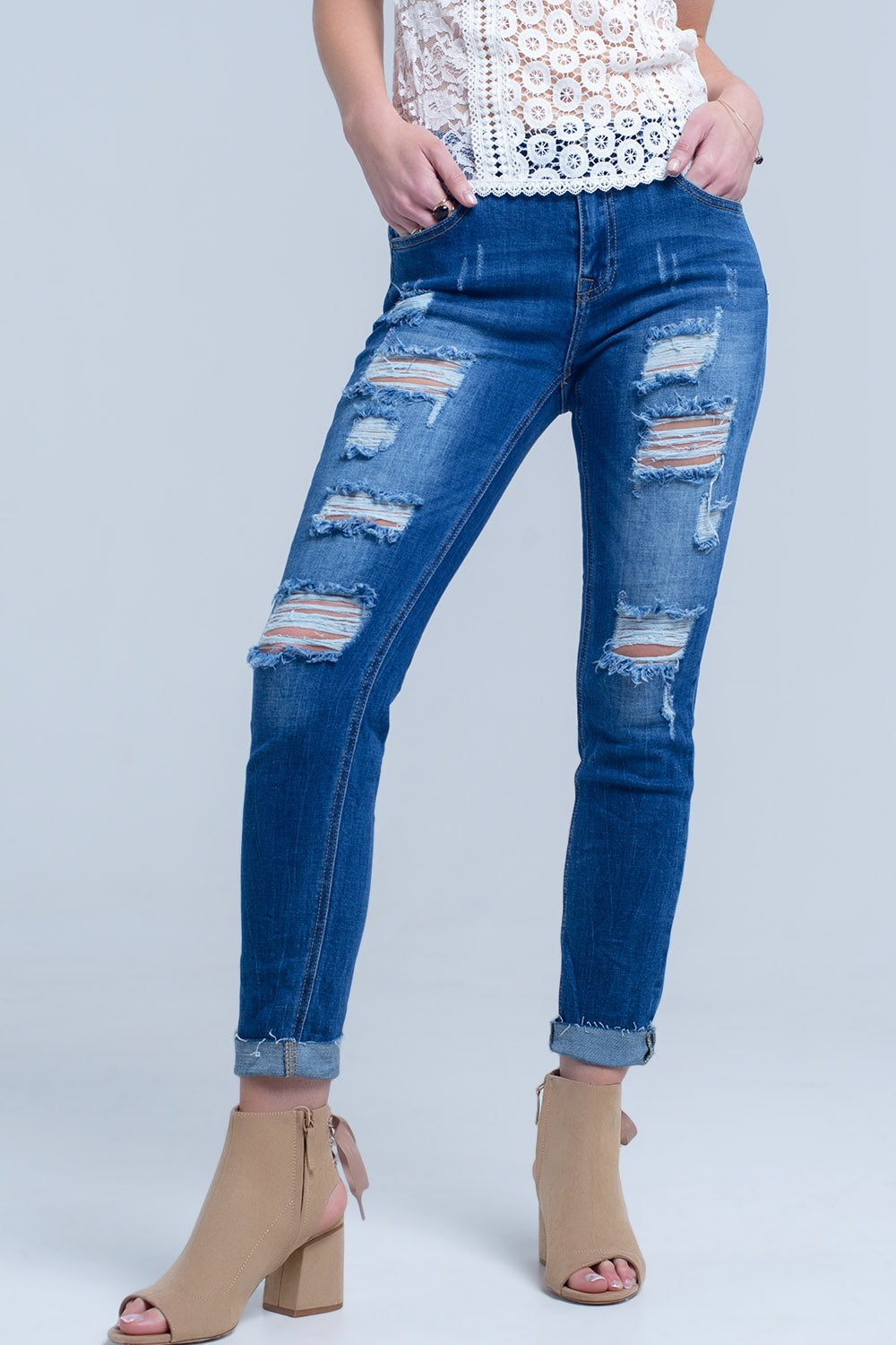 Jean with shredded rips and raw-cut cuffs