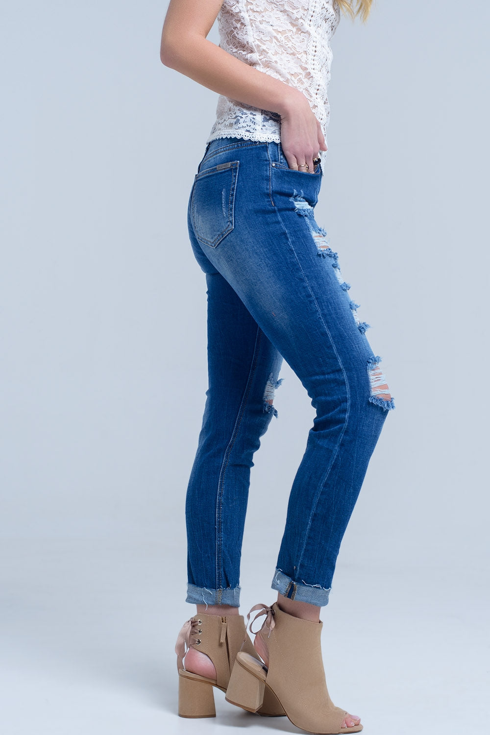 Jean with shredded rips and raw-cut cuffs