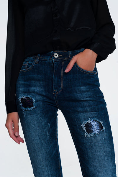 Jeans with sequins and rips