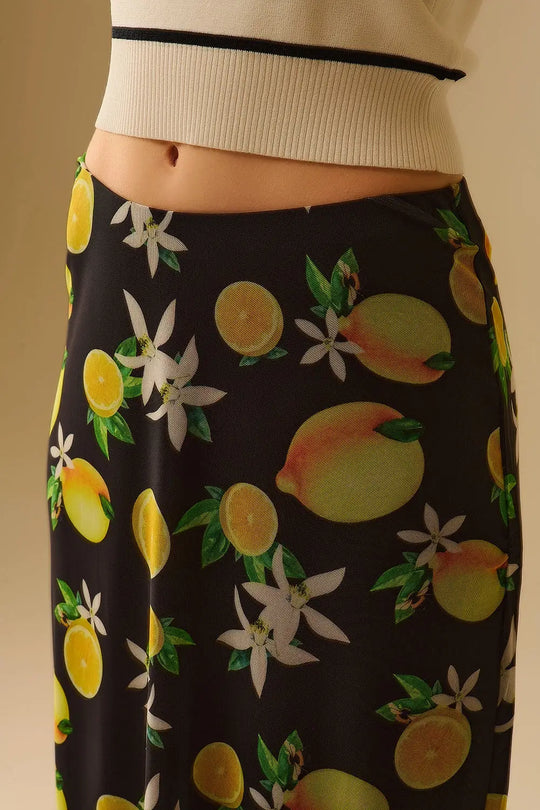 Jupe midi ajustée en maille noire avec imprimé citron - Jupes