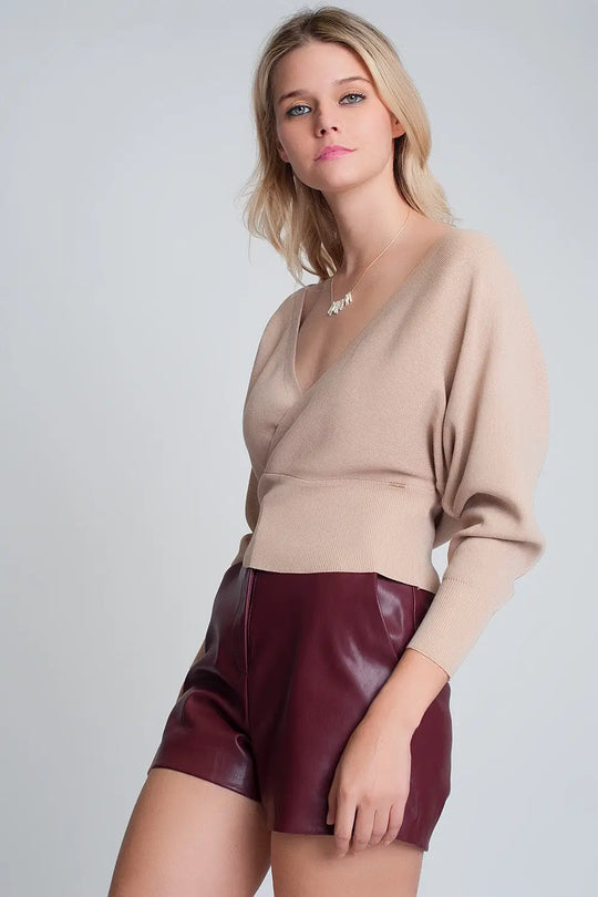 Knitted sweater with wrapped V-neck in beige - Sweaters