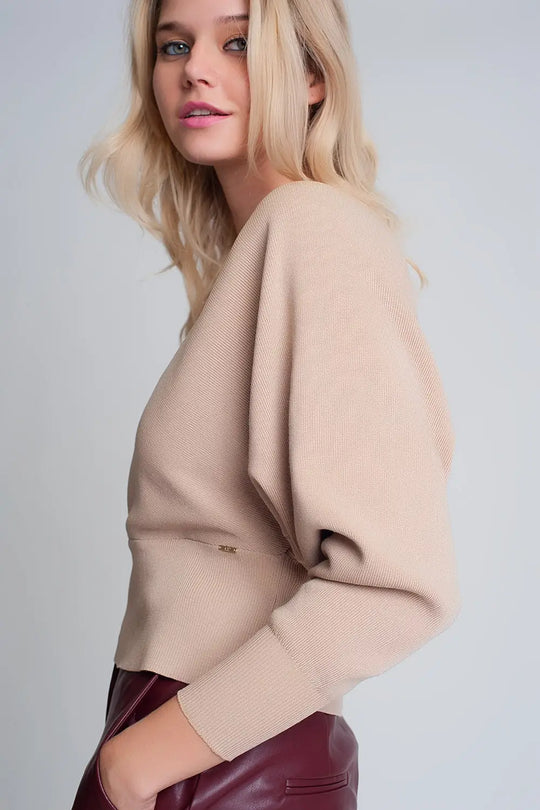 Knitted sweater with wrapped V-neck in beige - Sweaters