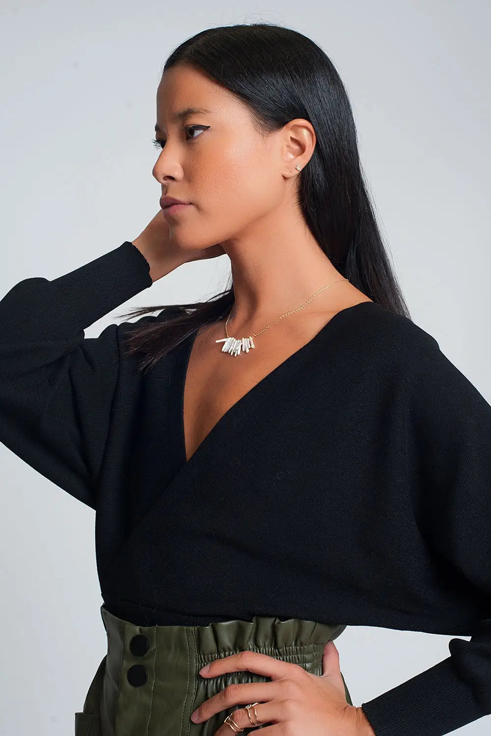 Knitted sweater with wrapped V-neck in black - Sweaters