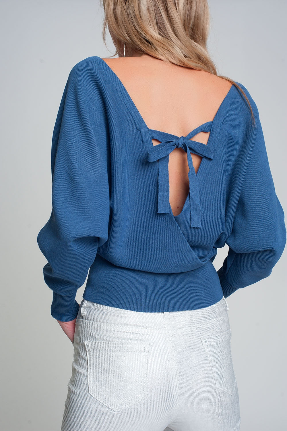 Knitted sweater with wrapped V-neck in blue