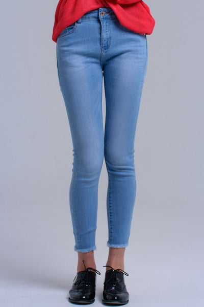 Light blue skinny jeans with fringes