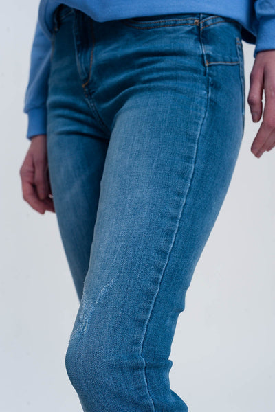 light denim skinny jeans with folded ankles and ripped detail