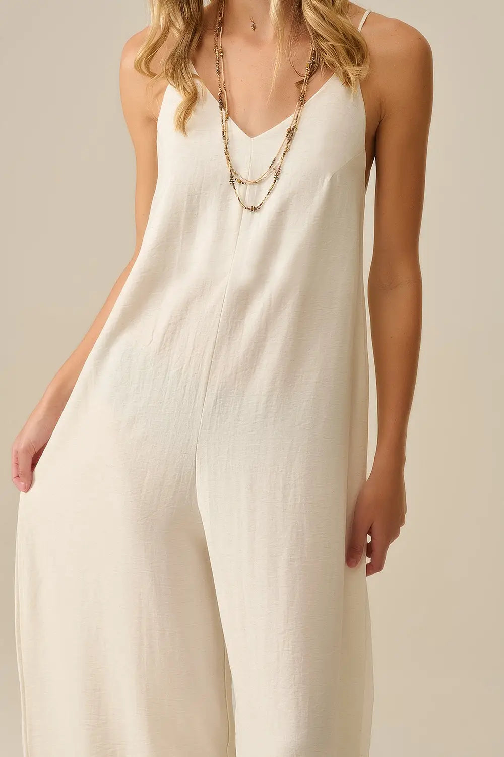 Long Textured Jumpsuit with Beaded Straps in Cream - Dresses