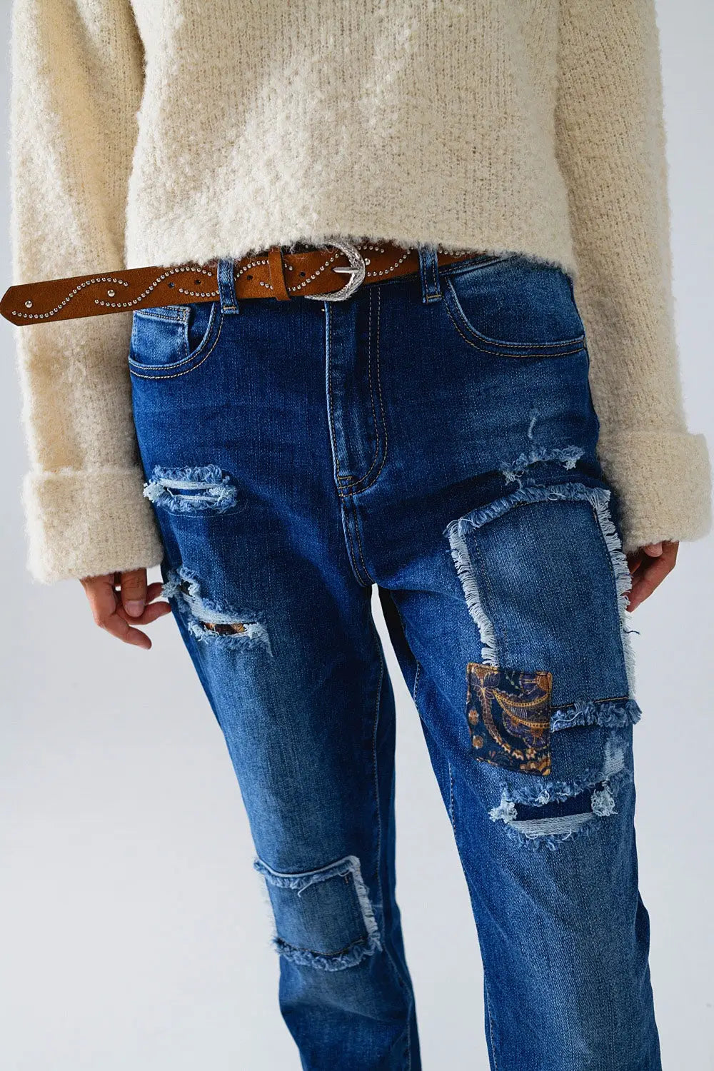 Loose blue jeans with subtle ripped design and patches - Jeans