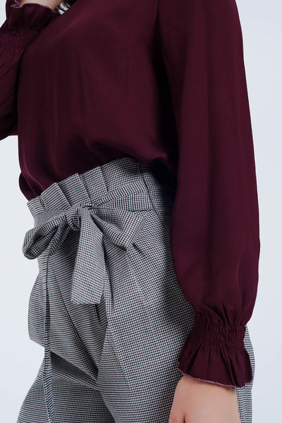 Maroon shirt with neck and sleeve detailed ends