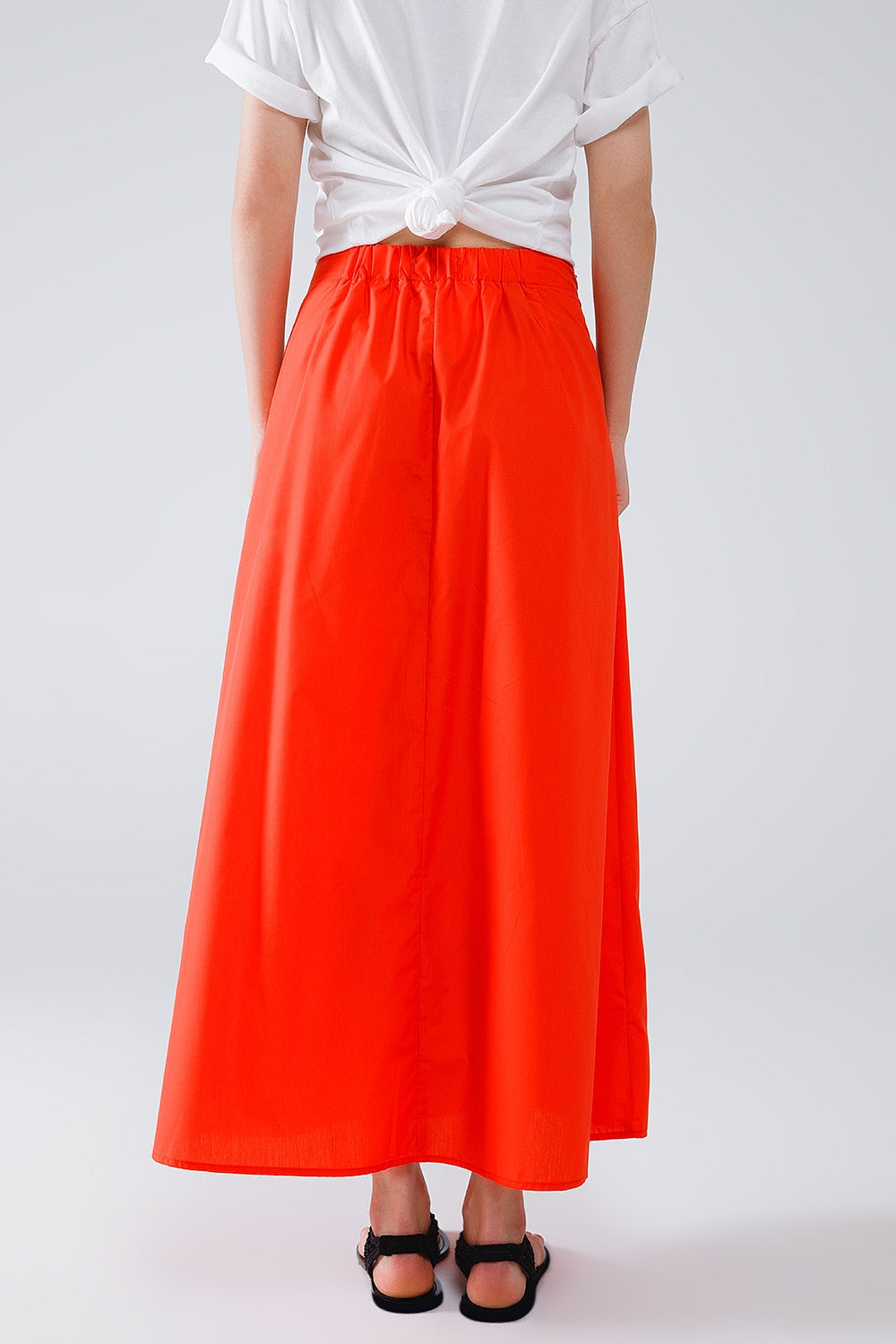 Maxi orange poplin skirt with knot detail at the waist