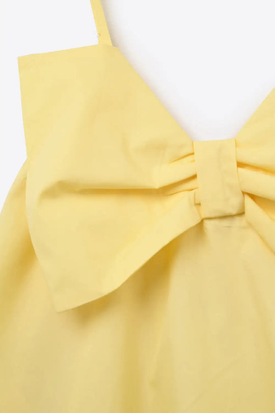 Mini robe en popeline jaune avec un gros nœud - Vestidos
