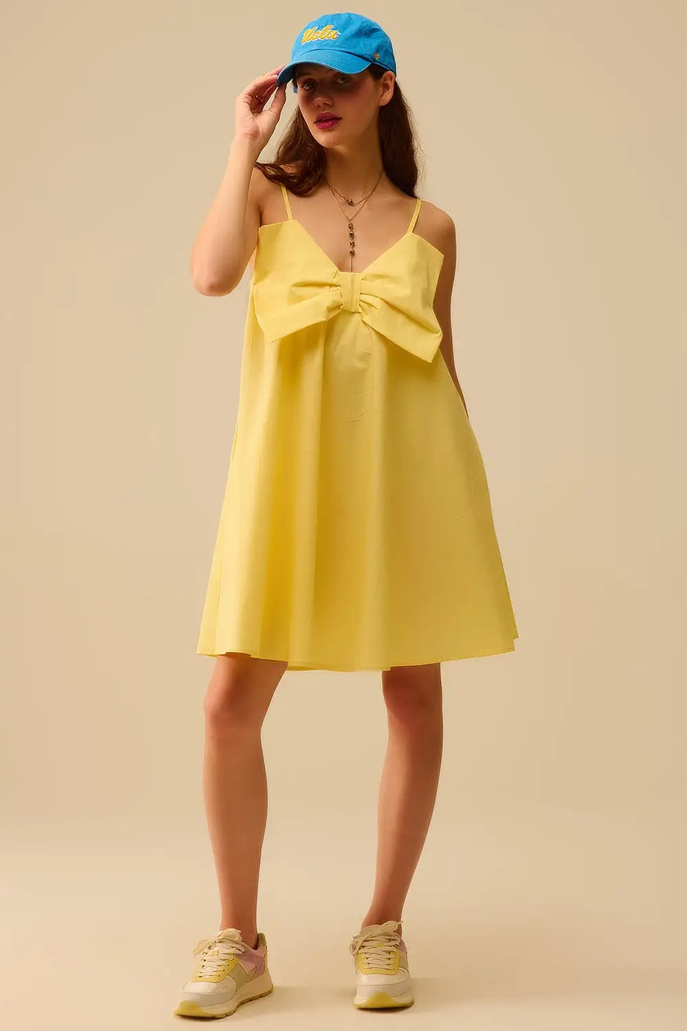 Mini robe en popeline jaune avec un gros nœud - Vestidos