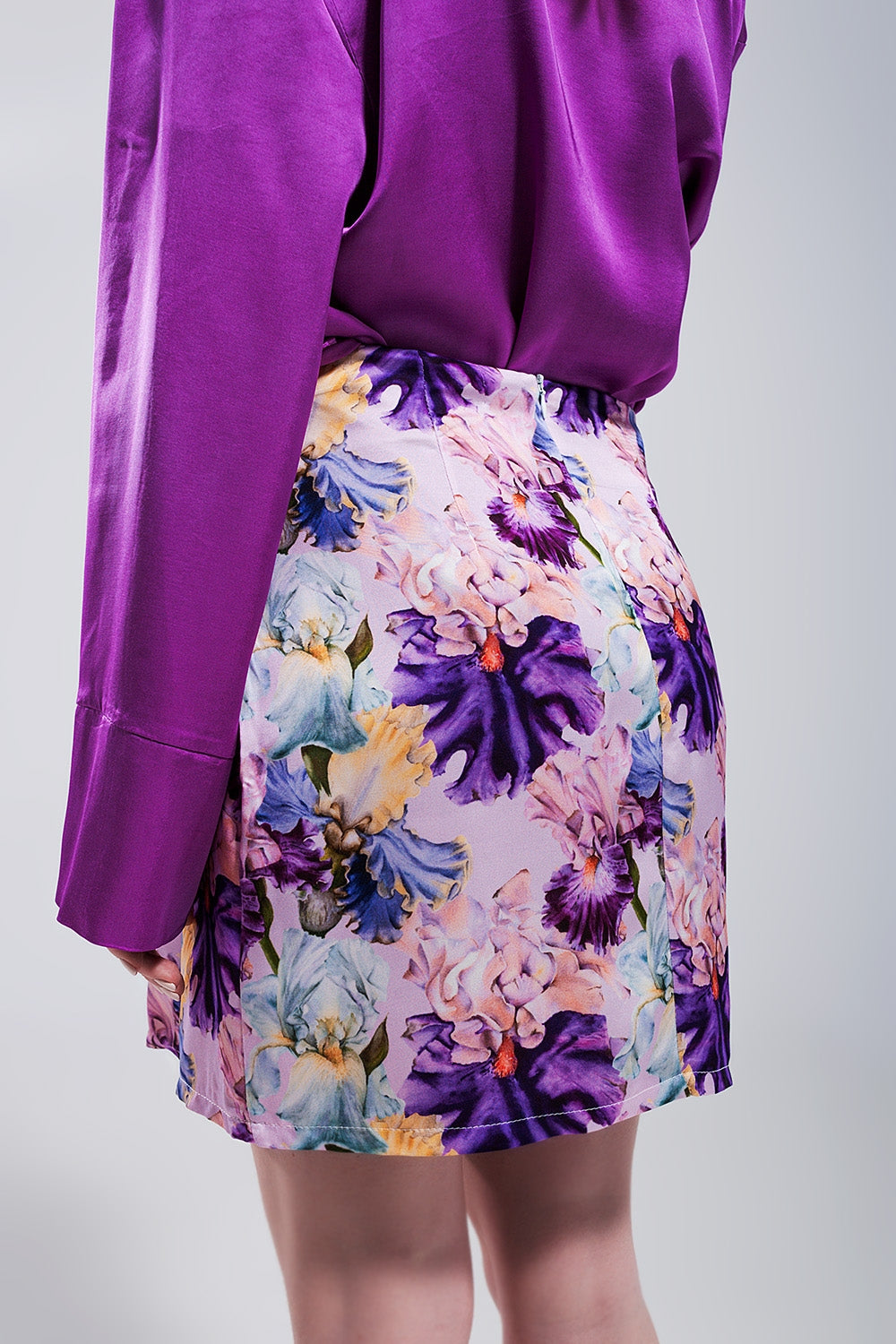 Mini skirt with knot front in purple clashing floral print