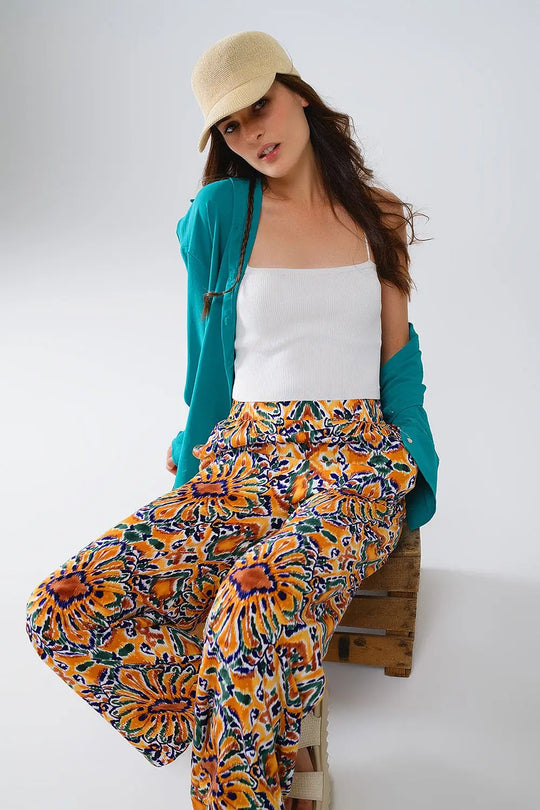 Multicolor Pants With Flower Print In Orange And Blue - Pants