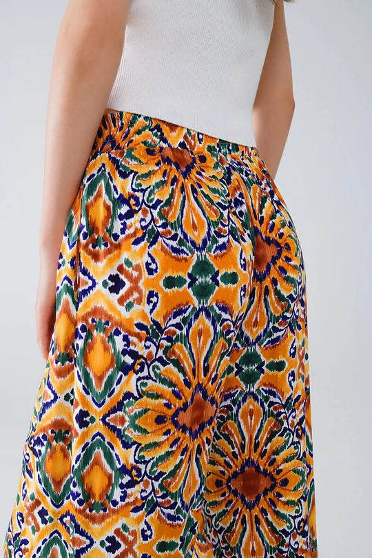 Multicolor Pants With Flower Print In Orange And Blue - Pants