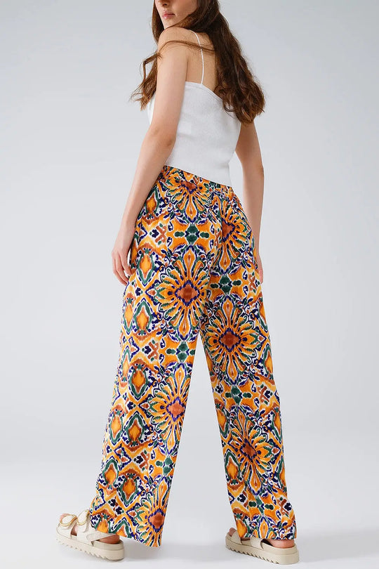 Multicolor Pants With Flower Print In Orange And Blue - Pants