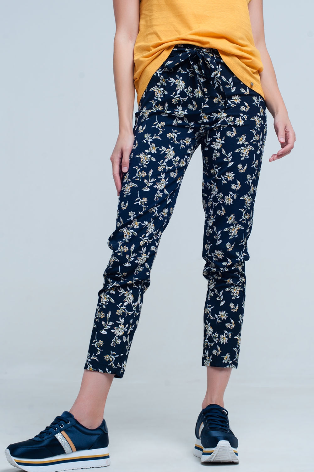 Q2 Navy floral pants with a belt