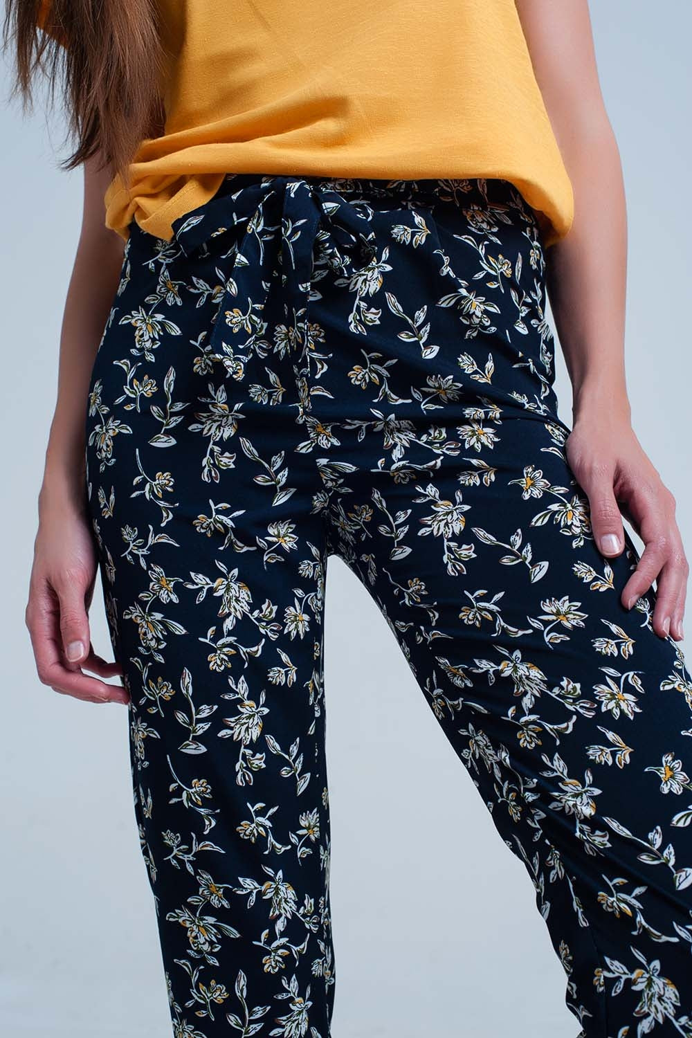 Navy floral pants with a belt