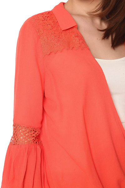 Orange blouse with wrap front and draped detail