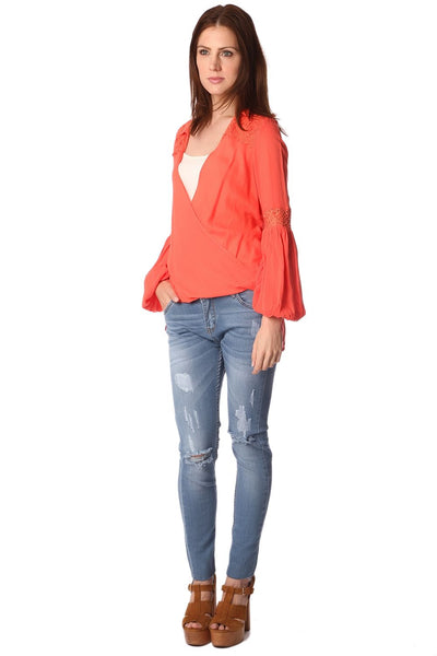 Orange blouse with wrap front and draped detail