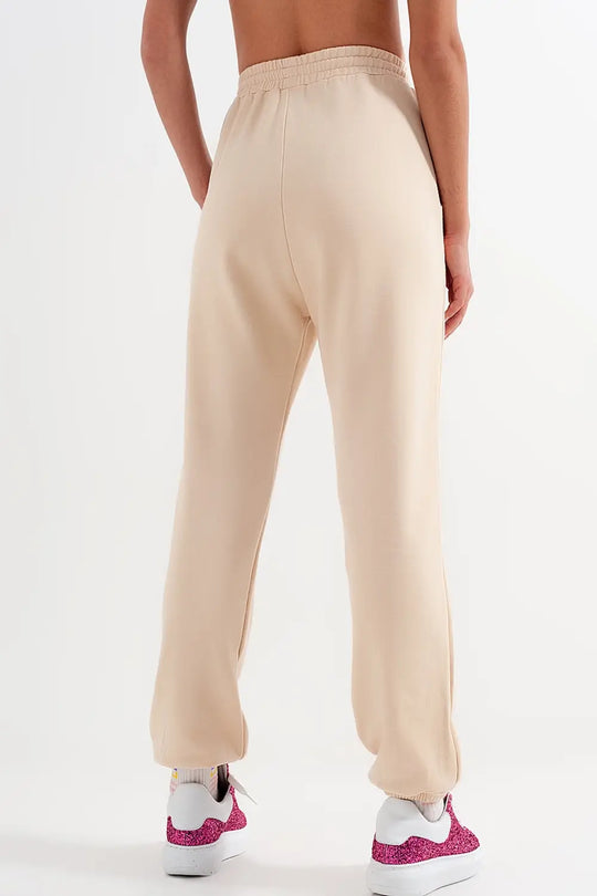 Pantalon de jogging avec bande élastique à la taille beige - Pantalons