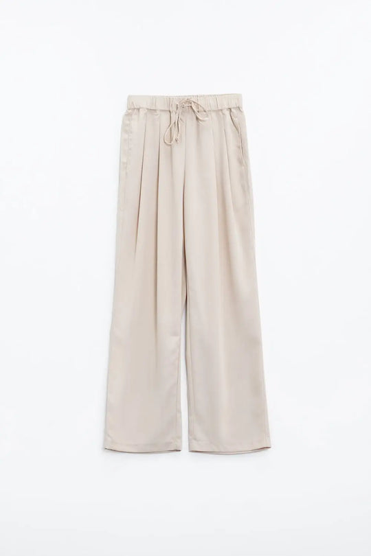 Pantalon en beige avec poches avant et fermeture par cordon de serrage - Pantalons