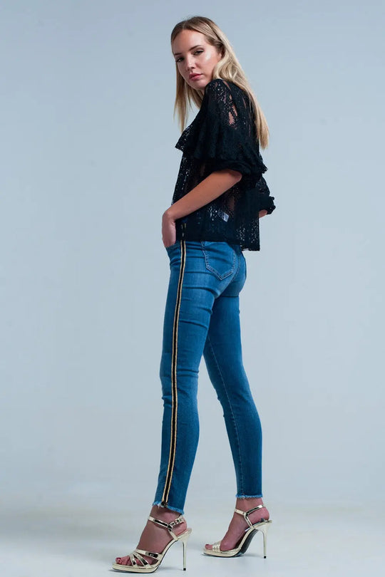 Pantalon en denim bleu avec bande latérale en or et noir - Pantalons