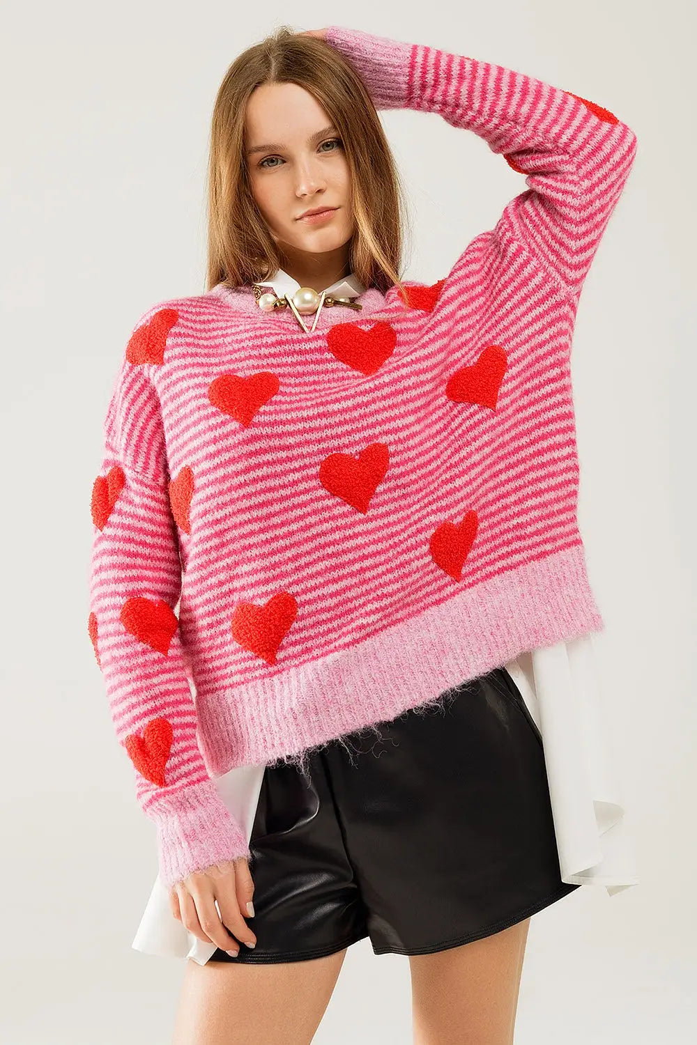 Q2 pink striped Sweater with hearts in red color