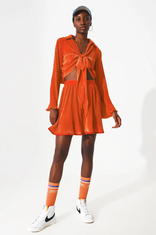 Pleated short skirt in orange - Skirts