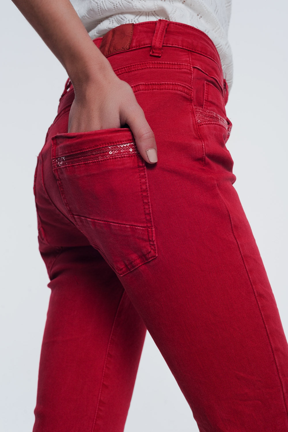 red boyfriend jeans with button closure