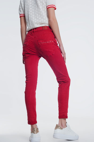 red boyfriend jeans with button closure