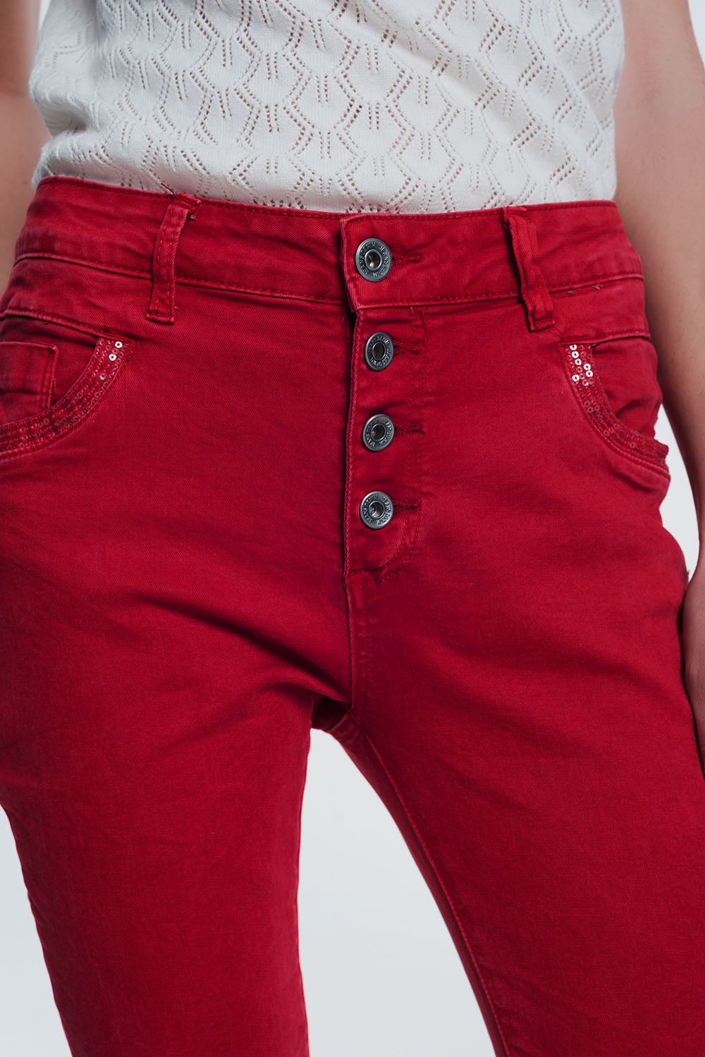 red boyfriend jeans with button closure