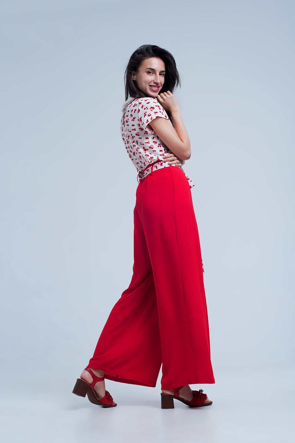 Red pants with floral belt