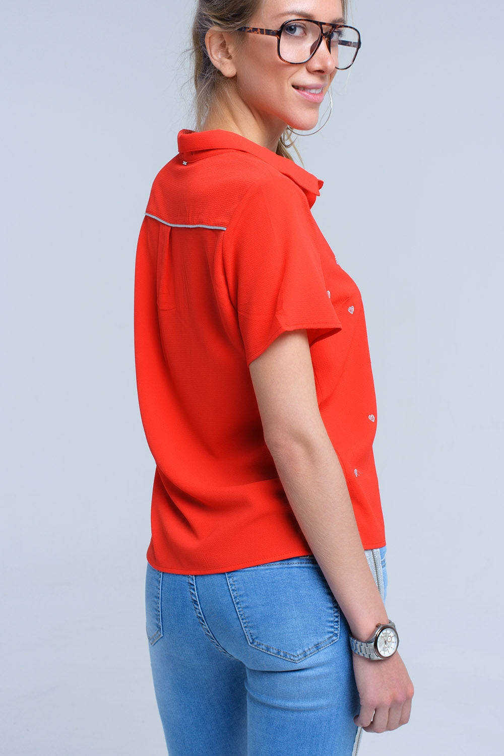 Red shirt with heart embroidery